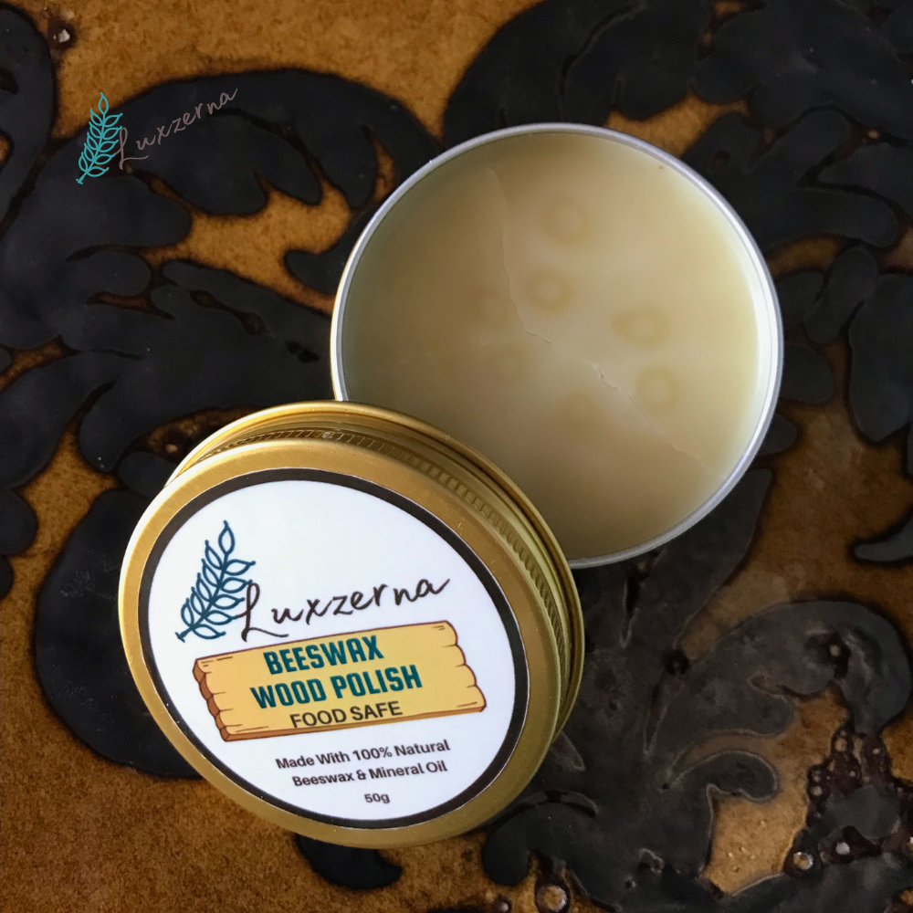 Open tin of Luxzerna beeswax wood polish on a decorative surface